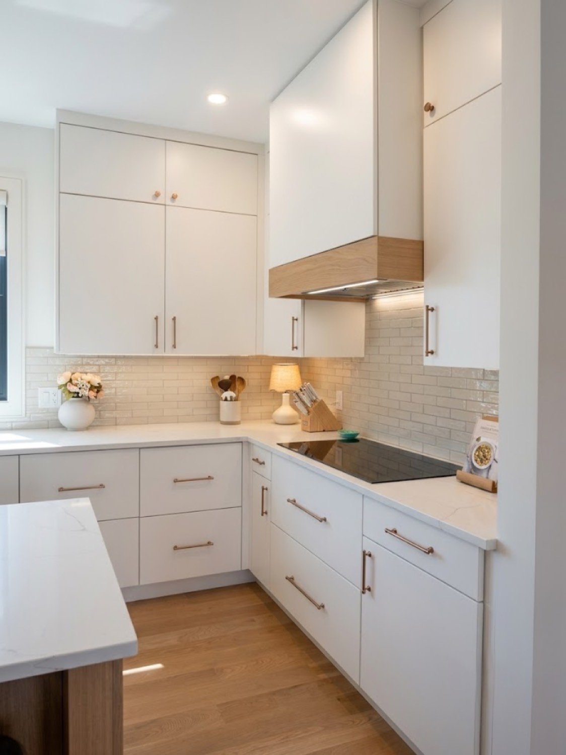 Renovated kitchen with custom cabinetry and quartz counters
